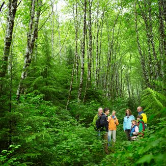 family hiking a trail